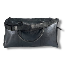 Женская дорожная сумка, черная, вместительная и стильная.